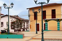 Lamps and buildings in the corner of Plaza Bolivar in Alausi. Ecuador, South America.