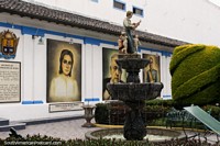 Patio with fountains and murals of important local people at the government building in Pujili. Ecuador, South America.