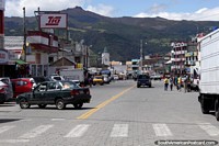 The main street of Machachi with mountains behind.