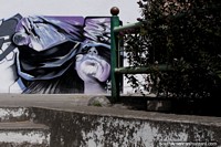 Larger version of Purple mural with purple flowers beside in Machachi.