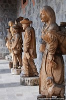 Series of life-size wood carvings outside the cultural center in Ibarra.