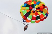 Parasailing, coming in for a landing but missed and dropped into the ocean in Atacames. Ecuador, South America.
