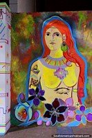 Woman with red hair and various ornaments, street art in Machala.