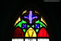 Stained glass window at the church in Zaruma with many colors. Ecuador, South America.
