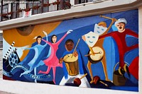 Larger version of Maracas, drums, masks and dancers, a musical themed mural in Loja, stunning.