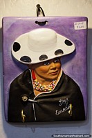 Man in hat with black jacket and colorful necklace, crafts at Almacen Artesanal Municipal, Loja. Ecuador, South America.