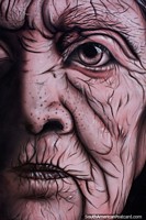 Close-up and detailed view of the face of an elder, awesome street art in Zamora. Ecuador, South America.