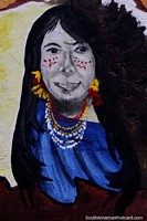 Mujer indígena con pintura facial, flores y collares, arte callejero en Macas. Ecuador, Sudamerica.