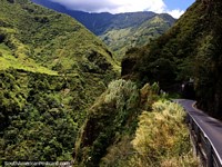 Tunnel on the route of waterfalls in Banos, cliff to the left is a huge straight drop. Ecuador, South America.