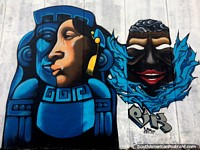 Versão maior do Arte de rua cultural com uma imagem de uma mulher, um Deus azul e uma máscara em Latacunga.