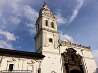 Santo Domingo Church in Quito began construction in 1540, white with arched stone entrance. Ecuador, South America.