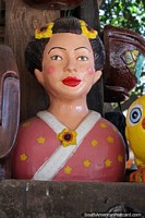 Larger version of Pretty woman made of ceramic with flowers in her hair and painted nicely made in Aregua.