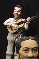 Man playing guitar, ceramic work at the cultural center in Aregua. Paraguay, South America.