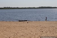 View from the beach across the bay to the ecological reserve in Asuncion. Paraguay, South America.