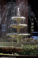 Fountain spraying water in the plaza in Asuncion. Paraguay, South America.