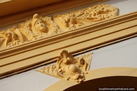 Ceramic face and decoration above a doorway in Concepcion. Paraguay, South America.