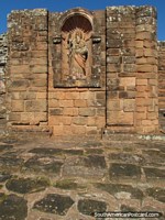 An arch with statue figure at the Jesuit church entrance at Trinidad. Paraguay, South America.