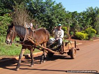 Man on horse and cart gives the thumbs up in Jesus near Encarnacion. Paraguay, South America.