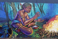 An indigenous man builds a fire, another great mural in Asuncion. Paraguay, South America.