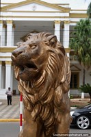 Gold sculptured lion across the road from the government palace in Villarrica. Paraguay, South America.