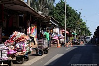 Blankets and clothing arrive at the street stalls on trolleys in Ciudad del Este. Paraguay, South America.