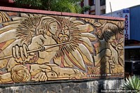 An indigenous battle scene, sculptured mural in Ciudad del Este. Paraguay, South America.