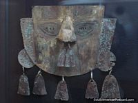 The face of the Chimu, metal artifact at Chan Chan museum. Peru, South America.