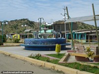 Dolphin fountain in a place called Acapulco south of Zorritos. Peru, South America.