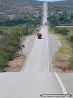 A long, straight and rolling road west of Bagua Grande. Peru, South America.