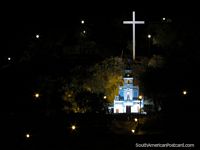Larger version of Church, cross and lights of Cerro Santa Apolonia in Cajamarca at night.