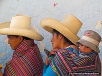 Indigenous locals wear traditional clothing in Cajamarca streets. Peru, South America.