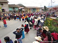 Street parade comes up from the plaza to the hills in Huamachuco. Peru, South America.