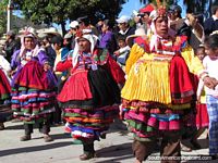 Indians in layered dress costumes in Huamachuco festival. Peru, South America.
