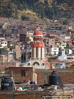 Red church and houses in Huaraz, view from the mirador. Peru, South America.