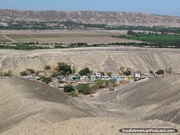 Larger version of Houses in a valley between Nazca and Ica.