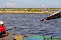 River boat packed with freshly cut bananas, Ucayali River, Pucallpa. Peru, South America.