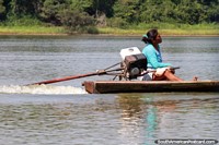 Native woman steers her canoe along the lake at Lake Yarinacocha in Pucallpa.