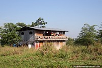 Larger version of Weather-worn wooden house of the Amazon, beside the road between Pucallpa and Tingo Maria.