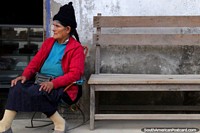 Larger version of A local woman of Pizana sits outside her house, Tocache to Juanjui.