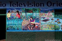 Mural of a woman working at the Radio Television Oriente building in Yurimaguas. Peru, South America.