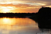 Peru Photo - Orange and yellow sunset over the Huallaga River, south of the Maranon River and Lagunas in the Amazon.