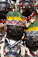 Caras de madera decoradas con cintas y plumas, Centro de Artes Anaconda, Iquitos. Per, Sudamerica.