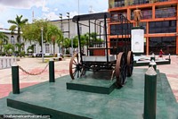 Plaza with an old metal car frame and statue of Ramon Castilla (1797-1867), President of Peru, Iquitos. Peru, South America.