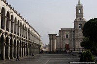 Spectacular arches and the cathedral at the Plaza de Armas in Arequipa, a beautiful plaza. Peru, South America.