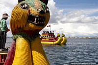 Riding a dragon boat is one of the highlights while visiting Lake Titicaca in Puno. Peru, South America.