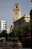 Clock tower and building on the corner of Kennedy Park in Lima, beside the church.