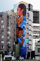 Huge mural on a building-side in Lima by pesimo93 (pesimoart.com), 2 indigenous women. Peru, South America.