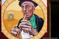 Larger version of Pijuanero, man with headband plays a wooden flute, mural in Lamas.