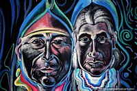 Pair of interesting faces, mural of the native people from Lamas in colorful clothing. Peru, South America.
