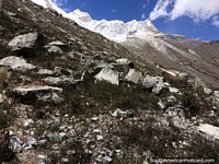 Harsh rocky terrain with snowy peaks in the mountains in Caraz. Peru, South America.